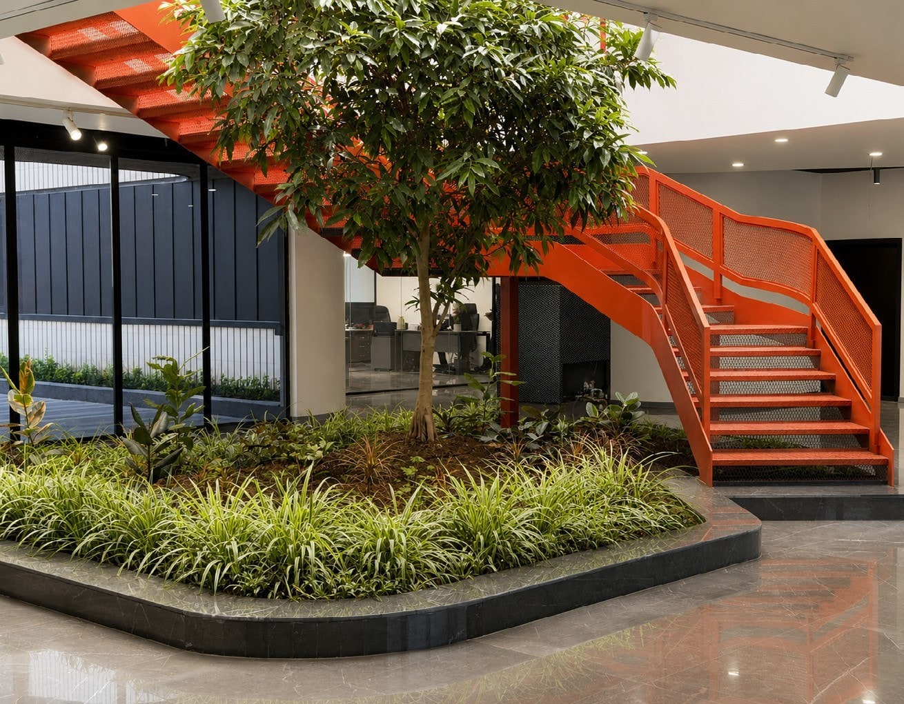 Orange stair rising from the planted courtyard