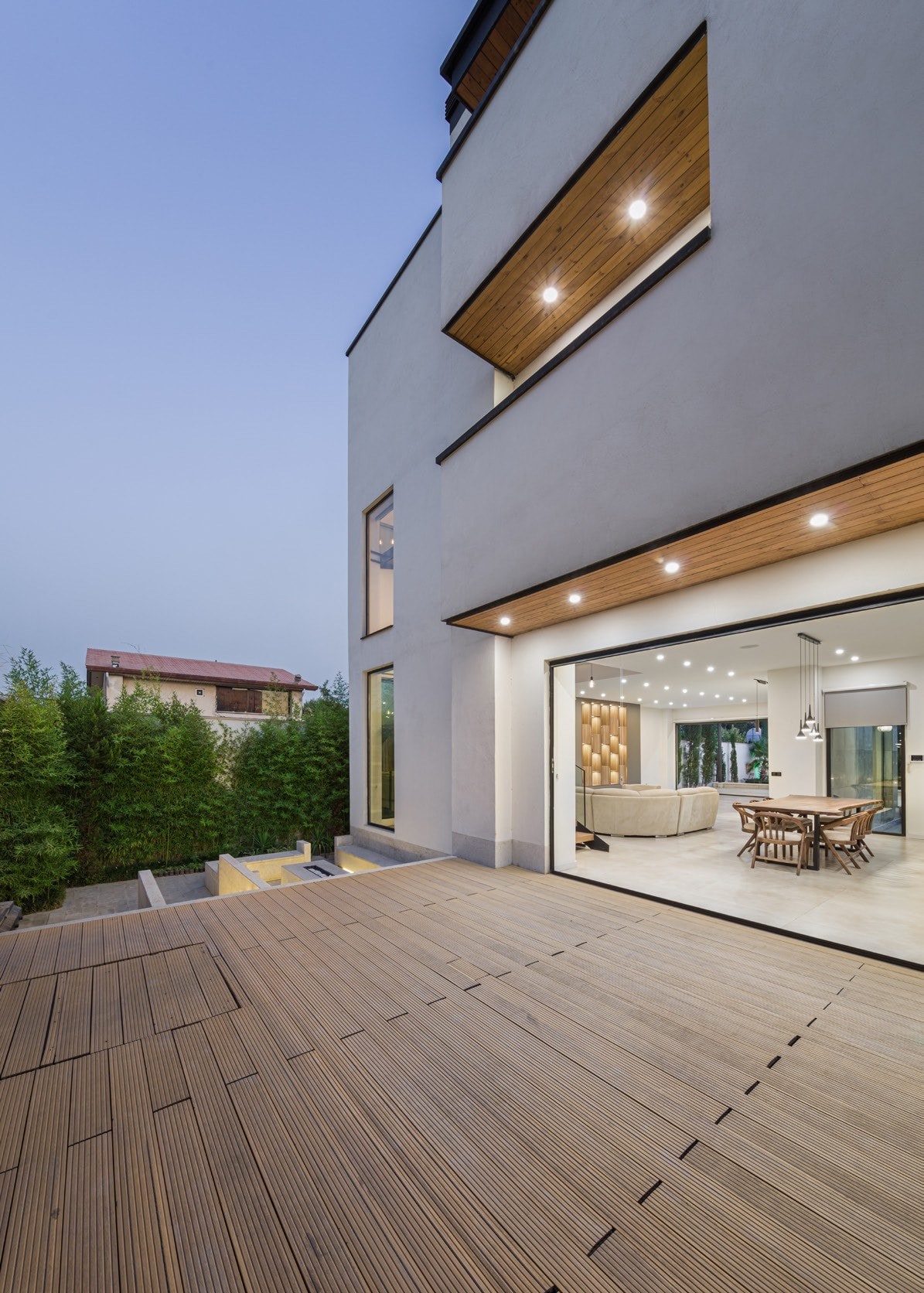 Terrace and living room at dusk