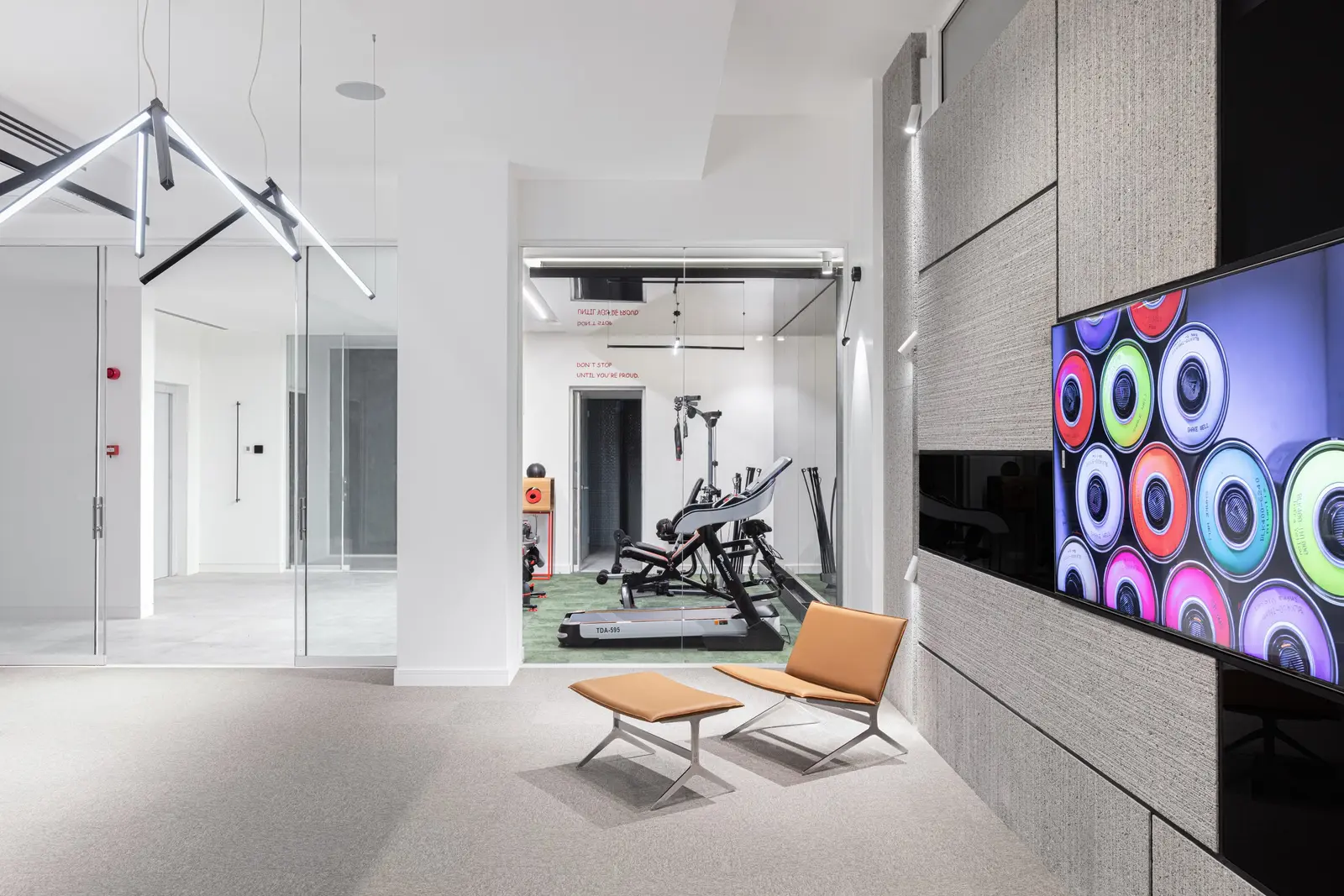 View from the game room into the glass-walled gym