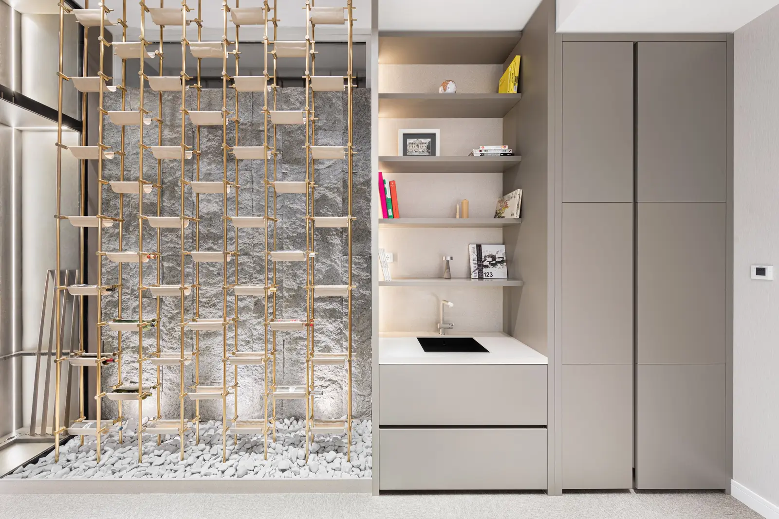Kitchenette with brass rack and stone backdrop