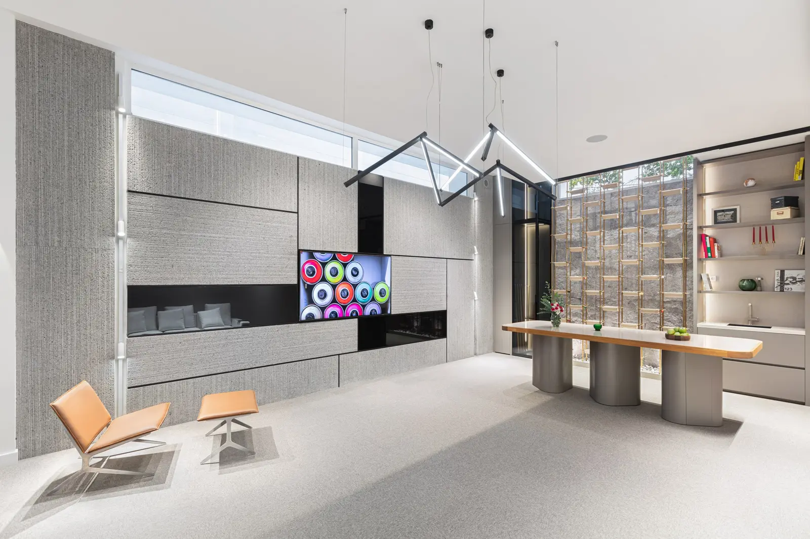 Play Corner game room with stone media wall and sculptural pendant